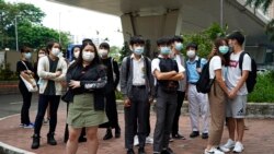 FILE: Young supporters of the former Studentlocalism leader Tony Chung wait outside a court, in Hong Kong, Oct. 29, 2020.