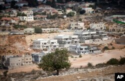 FILE - A general view of housing in the Israeli orthodox Jewish settlement of Revava, near the West Bank city of Nablus, Oct. 22, 2016.