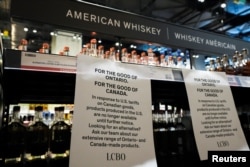 A paper notice lists the removal of bottles of U.S. alcohol from the shelves of a Liquor Control Board of Ontario (LCBO) store, as part of retaliatory moves against tariffs announced by U.S. President Donald Trump, in Toronto, Canada, March 4, 2025.