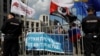 FILE - People hold a banner reading "Hands off the internet" during a rally against court decision to block the Telegram messenger because it violated Russian regulations, in Moscow, May 13, 2018. 