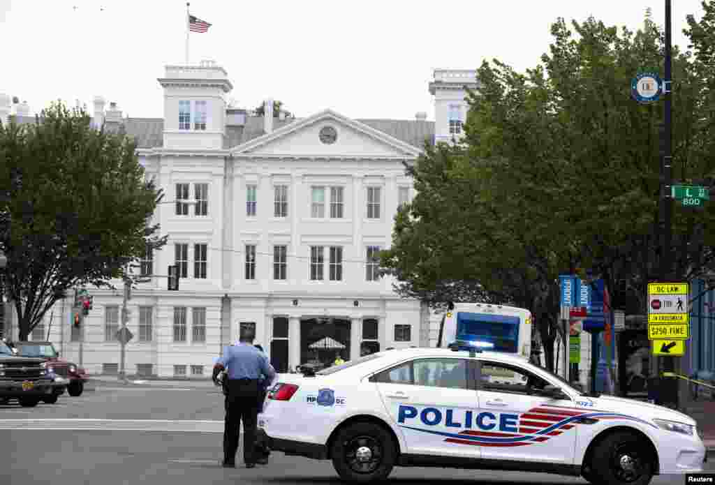 A police vehicle is seen as police respond to a shooting at the Washington Navy Yard, Sept. 16, 2013. 