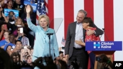 Sen. Tim Kaine, D-Va., hugs his wife Anne Holton during a with Democratic presidential candidate Hillary Clinton at Florida International University Panther Arena in Miami, Saturday, July 23, 2016.