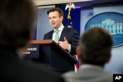 FILE - White House press secretary Josh Earnest at a White House press briefing in Washington, Sept. 18, 2015. Earnest called Trump's calls for a ban on Muslims entering the country "offensive and toxic."