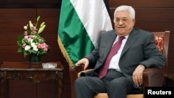 FILE - Palestinian President Mahmoud Abbas is seen in his office in the West Bank city of Ramallah, June 21, 2017.