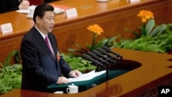 China's newly-installed President Xi Jinping speaks at the closing ceremony of the National People's Congress at the Great Hall of the People in Beijing Sunday, March 17, 2013. 
