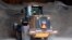 A worker at a Pennsylvania Department of Transportation maintenance area in Franklin Park, Pa., along Interstate 79 north of Pittsburgh, uses heavy machinery to move road treatment material from storage to load onto trucks, March 13, 2017.