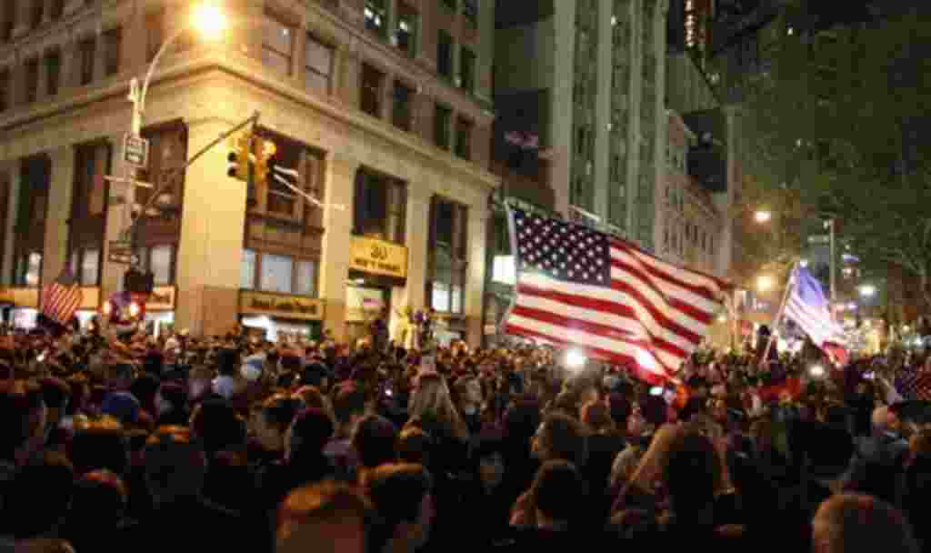A large, jubilant crowd reacts to the news of Osama Bin Laden's death at the corner of Church and Vesey Streets, adjacent to ground zero, during the early morning hours of Tuesday, May 2, 2011 in New York (AP)