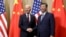 Presiden Joe Biden berjabat tangan dengan Presiden China Xi Jinping sebelum pertemuan bilateral, Sabtu, 16 November 2024, di Lima, Peru. (Leah Millis/Pool Photo via AP)