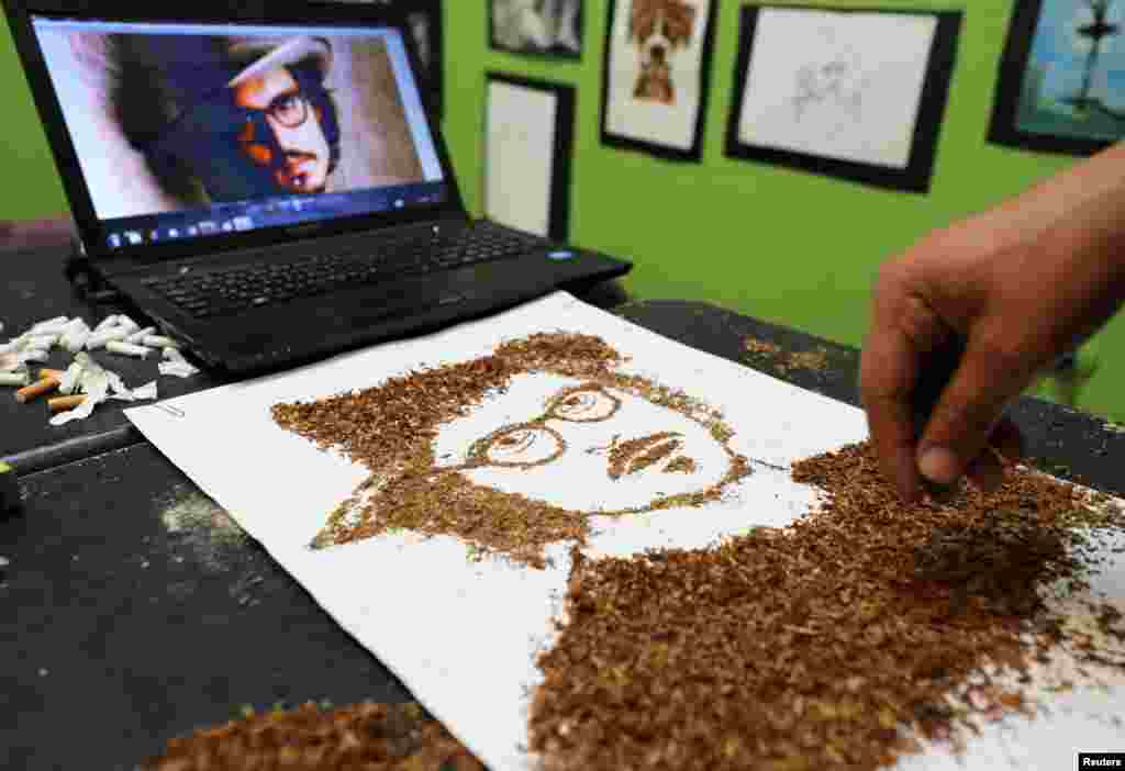 Artist Abdelrahman al-Habrouk creates a portrait of the actor Johnny Depp with tobacco in Alexandria, Egypt.