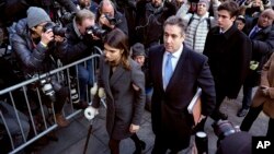 Michael Cohen, center, President Donald Trump's former lawyer, accompanied by his children Samantha, left, and Jake, right, arrives at federal court for his sentencing in New York, Dec. 12, 2018.