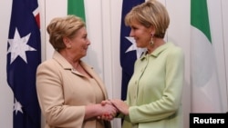 Australian Foreign Minister Julie Bishop, right, shakes hands with Deputy Prime Minister of Ireland Frances Fitzgerald at Parliament House in Canberra, Australia, Oct. 16, 2017.