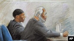 In this courtroom drawing, Umar Farouk Abdulmutallab (L) appears in federal court with Anthony Chambers, a lawyer who is assisting him in his defense, in Detroit, October 4, 2011.