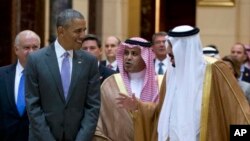 President Barack Obama and Saudi Arabia's King Salman walk to President Obama's motorcade after meeting at Erga Palace in Riyadh, Saudi Arabia, Wednesday, April 20, 2016. The president began a six day trip to talk with his counterparts in Saudi Arabia, England and Germany. (AP Photo/Carolyn Kaster)