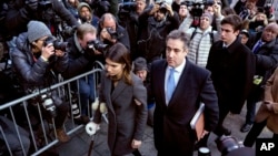 Michael Cohen, center, President Donald Trump's former lawyer, accompanied by his children Samantha, left, and Jake, right, arrives at federal court for his sentencing in New York, Dec. 12, 2018.