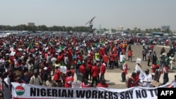 FILE — Protestors gather near the Nigeria National Assembly during a protest in Abuja on February 27, 2024.