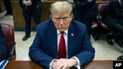 FILE - Former President Donald Trump waits for the start of proceedings in Manhattan criminal court in New York, April 23, 2024. 