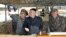 Photo taken by North Korea's official Korean Central News Agency on March 20, 2013 shows North Korean leader Kim Jong Un (C) inspecting a live fire drill at an undisclosed location in North Korea.