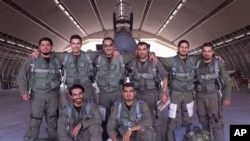 Saudi pilots pose for a group portrait after taking part in U.S.-led coalition airstrikes on Islamic State militants and other targets in Syria, Sept. 24, 2014.