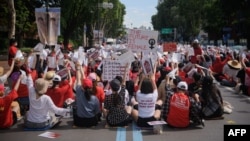 FILE - Female protesters call for South Korea's government to crack down on widespread spycam porn crimes during a rally in Seoul, July 7, 2018. 