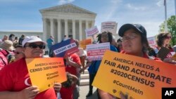 FILE - Immigration activists rally outside the Supreme Court as the justices hear arguments over the Trump administration's plan to ask about citizenship on the 2020 census, in Washington, April 23, 2019.