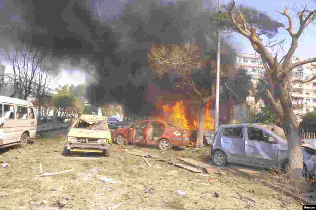 Vehicles burn after an explosion in central Damascus February 21, 2013. Syrian state media blamed what it said was a suicide bombing on &quot;terrorists&quot; battling President Bashar al-Assad.&nbsp;