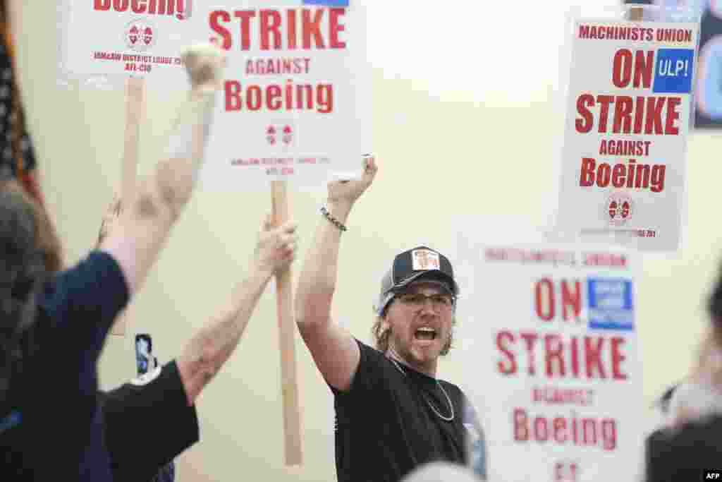 People react to an announcement that union members rejected a proposed Boeing contract and will go on strike, following voting results at their union hall in Seattle, Washington, on Sept. 12, 2024.