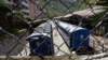 ARCHIVO - Trenes detenidos en la estación de tren de Aguas Calientes, cerca de Machu Picchu, en el departamento de Cusco de Perú, el 23 de enero de 2023. 