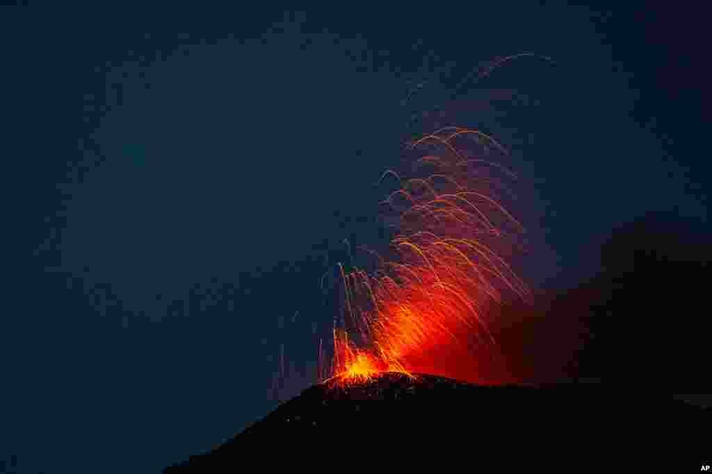 Pacaya volcano spews lava, viewed from San Vicente Pacaya, Guatemala, July 25, 2020.