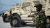 FILE - A Kenyan member of the Multinational Security Support mission stands next to an armored vehicle in Port-Au-Prince, Haiti, on Sept. 5, 2024. Jamaica announced on Sept. 10, 2024, that it was adding 24 soldiers and police to the MSS mission.