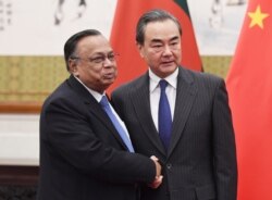 Bangladesh Foreign Minister A.H. Mahmood Ali, left, shakes hands with Chinese Foreign Minister Wang Yi before a meeting at the Diaoyutai State Guesthouse in Beijing Friday, June 29, 2018.