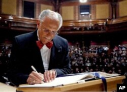 Warren Washington signing the book making him a member of the American Academy of Arts and Sciences, the same book that was signed by the founders of the United States (2009).