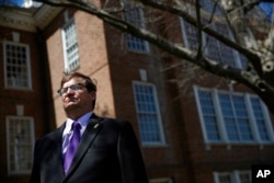 David Humes stands outside Legislative Hall, the state capitol building, in Dover, Del., April 26, 2018. Humes, whose son died from a heroin overdose in 2012, has been pushing for an opioid tax in Delaware, which did not increase funding for addiction treatment in 2017 as it struggles to balance its budget.