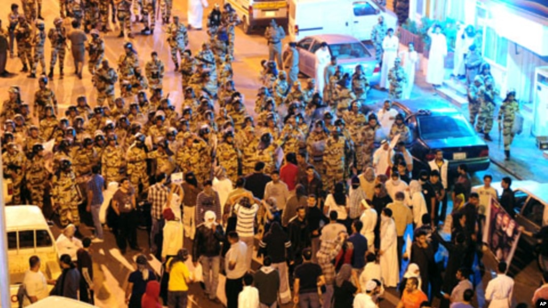 Anti-riot police stand-off with protesters in the Gulf coast town of Awwamiya, Saudi Arabia, March 3, 2011