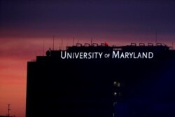 FILE - A building at the University of Maryland's Baltimore campus is seen after sunset, Aug. 19, 2019, in Baltimore.