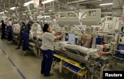 Workers assemble hospital beds in Linet factory in Slany, Czech Republic, Feb. 7, 2017.