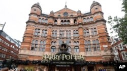 FILE - The Palace Theatre in London advertises, July 28, 2016, the new Harry Potter play: "Harry Potter and the Cursed Child," a two-part stage drama that picks up 19 years after the novels ended.