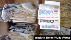 FILE - Stacks of South Sudanese newspapers sit on shelves in the office of the Association for Media Development in South Sudan in Juba, a day after The Citizen media group was ordered by government officials to shut down, May 6, 2019.