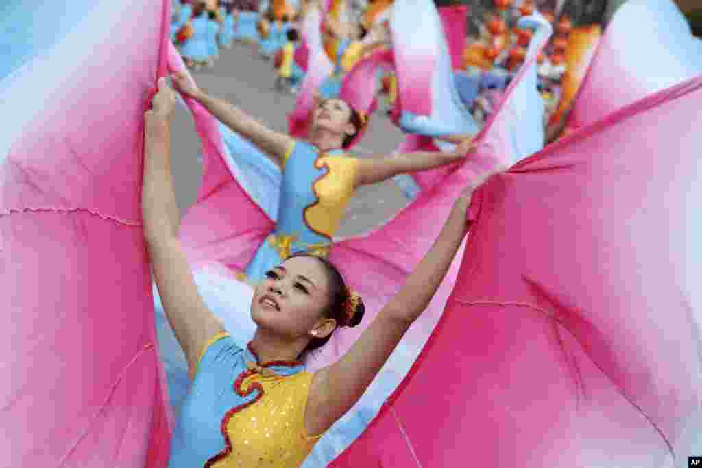Young dancers perform during National Day celebrations in Taipei, Taiwan. During President Ma Ying-jeou's keynote speech, he gave his support to Hong Kong's student protesters demanding universal suffrage in the 2017 election.