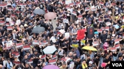 Protesters attend a demonstration demanding Hong Kong's leaders to step down in Hong Kong, China, June 16, 2019.