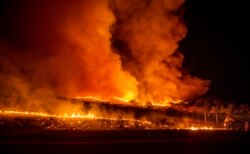 A firefighter battles the Kincade Fire near Geyserville, Calif., Oct. 24, 2019.