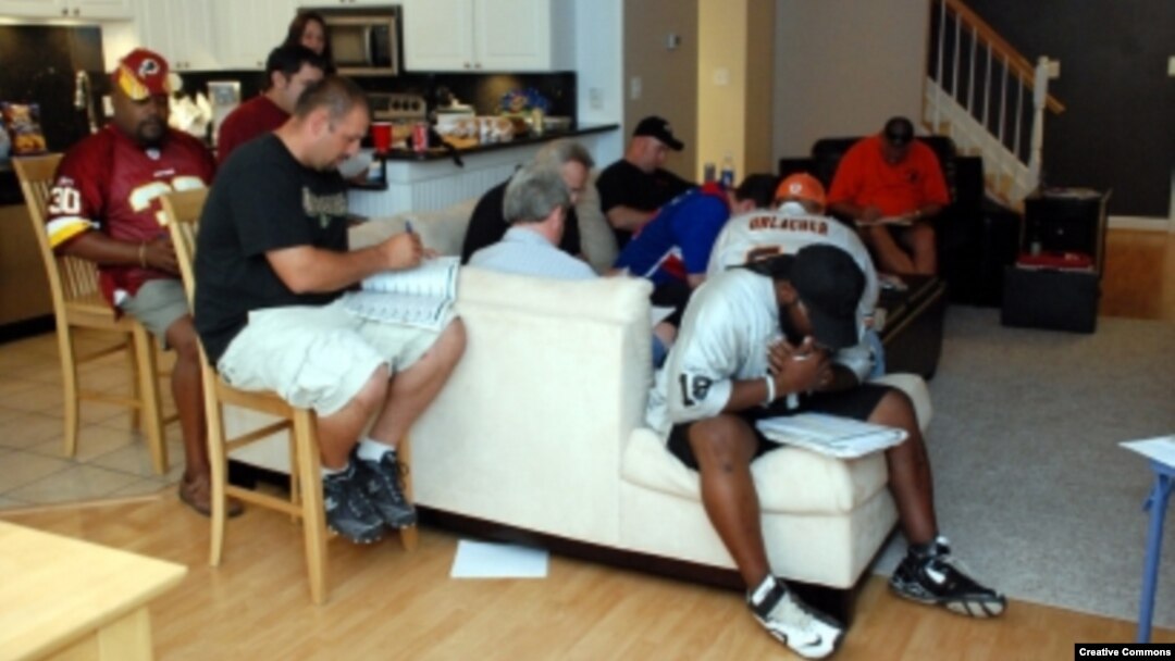 FILE -- Many fantasy football leagues hold draft parties, when league players get together to select their team’s players before the start of the season. (Photo by Flickr user David Clow via Creative Commons license)