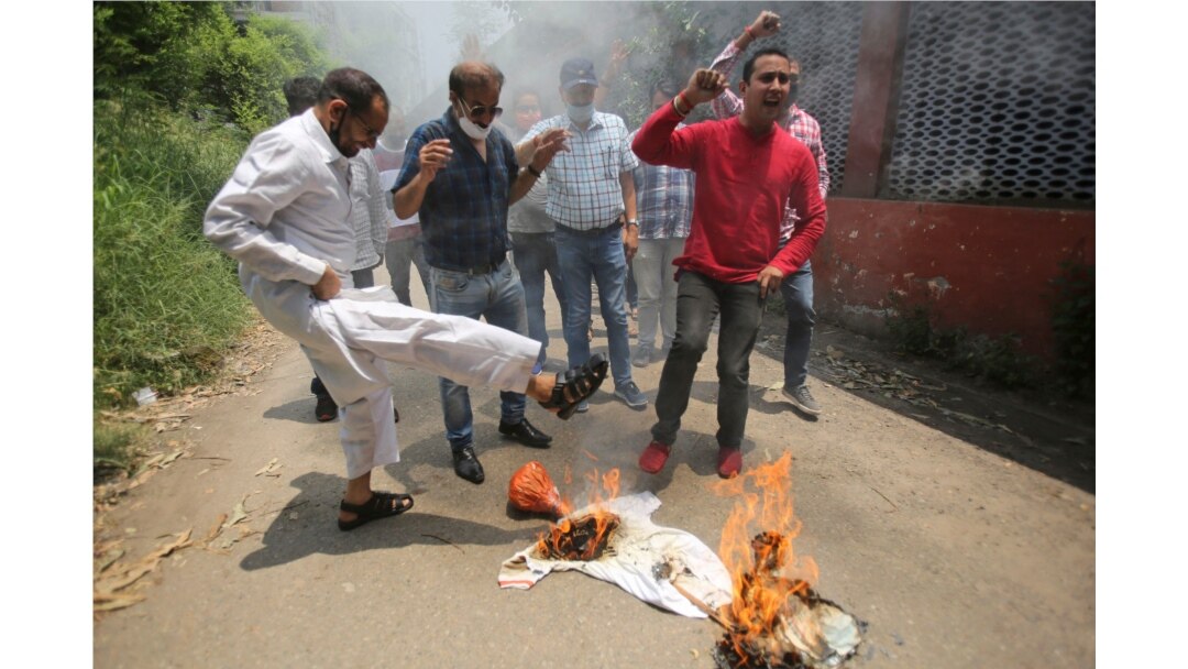 Janata Dal (United) activists burn an effigy representing China during a protest against the Chinese government in Jammu, India, Friday, June 19, 2020.