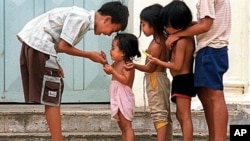 Cambodian orphans play together as they wait for adoption at Kien Klaing orphanage center in Phnom Penh, (File photo). 
