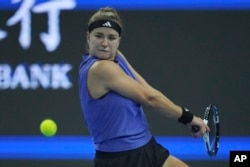 Karolina Muchova of Czech Republic returns a shot to Coco Gauff of the United States during the women's singles final match at the China Open tennis tournament at the National Tennis Center in Beijing, Oct. 6, 2024.