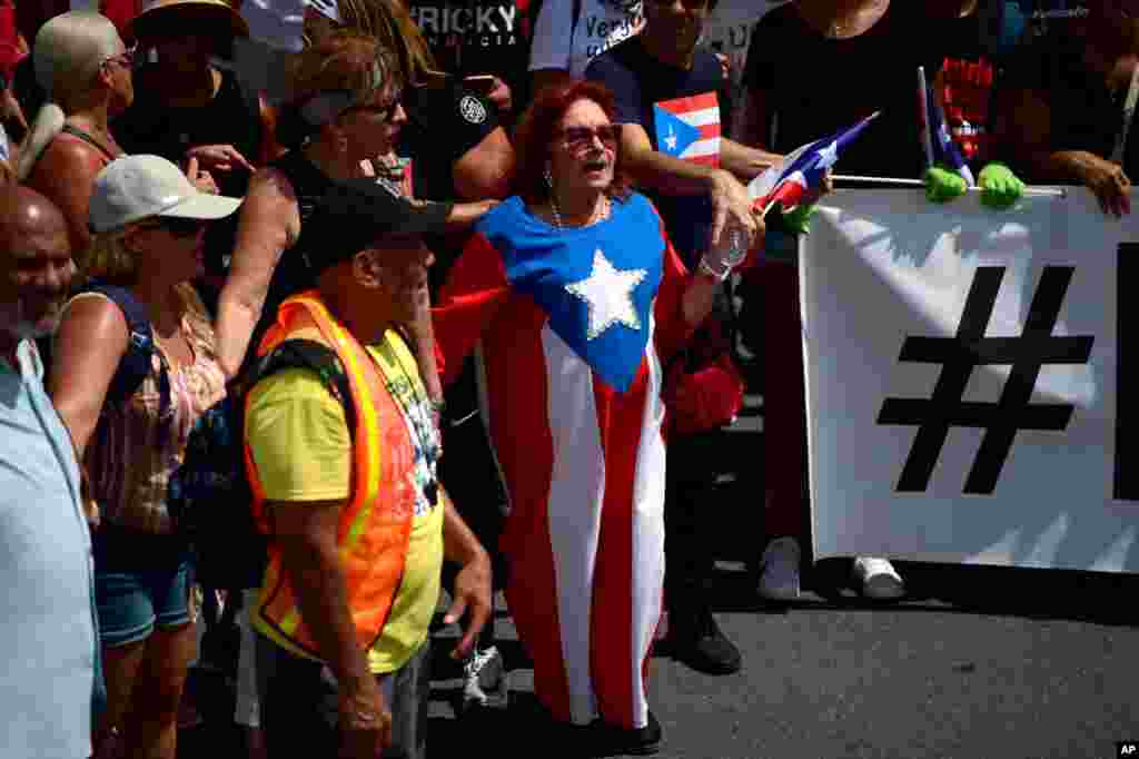 Thousands of Puerto Ricans gather for what was expected to be one of the biggest protests ever seen in the U.S. territory, with irate islanders pledging to drive Gov. Ricardo Rossello from office, in San Juan, Puerto Rico.