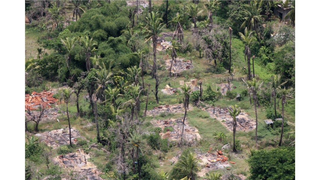 FILE - An aerial view shows burned down villages once inhabited by the Rohingya seen from the Myanmar military helicopters that carried the U.N. envoys to northern Rakhine state, Myanmar, May 1, 2018.