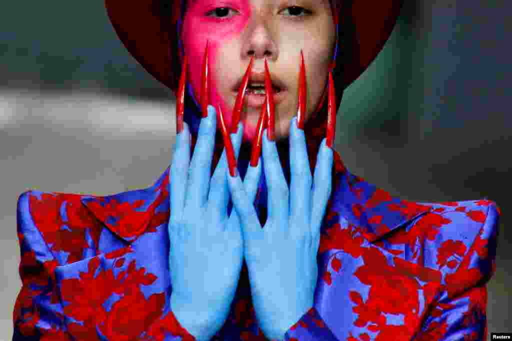 A model presents a creation by Hu Sheguang at China Fashion Week in Beijing.