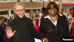 FILE - Film critic Roger Ebert and his wife Chaz Ebert arrive at the 36th Toronto International Film Festival, Canada, Sept. 13, 2011. 