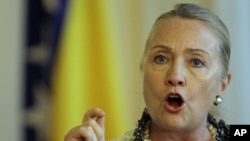 US Secretary of State Hillary Rodham Clinton gestures as she addresses journalists after meeting with the High Representative for EU Foreign Policy Catherine Ashton in Sarajevo, Bosnia, Oct. 30, 2012.