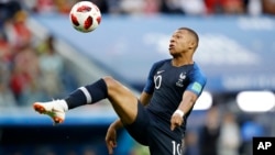 France’s Kylian Mbappe controls the ball during the semifinal match between France and Belgium at the 2018 soccer World Cup in St. Petersburg, Russia, July 10, 2018.